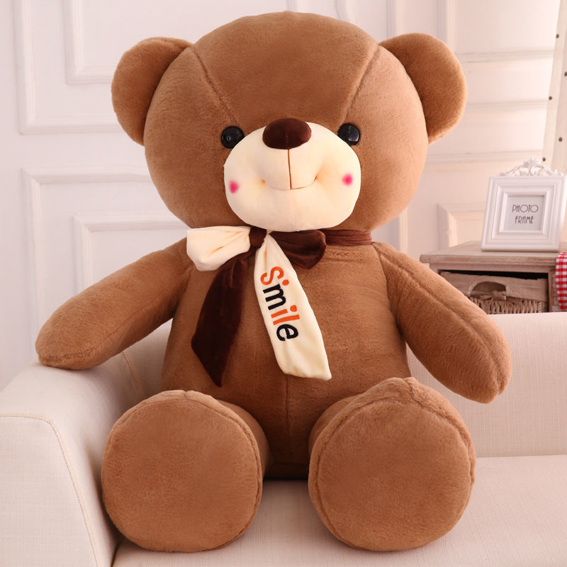 Smiling scarf teddy bear doll