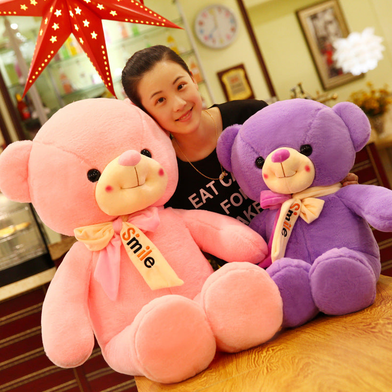 Smiling scarf teddy bear doll