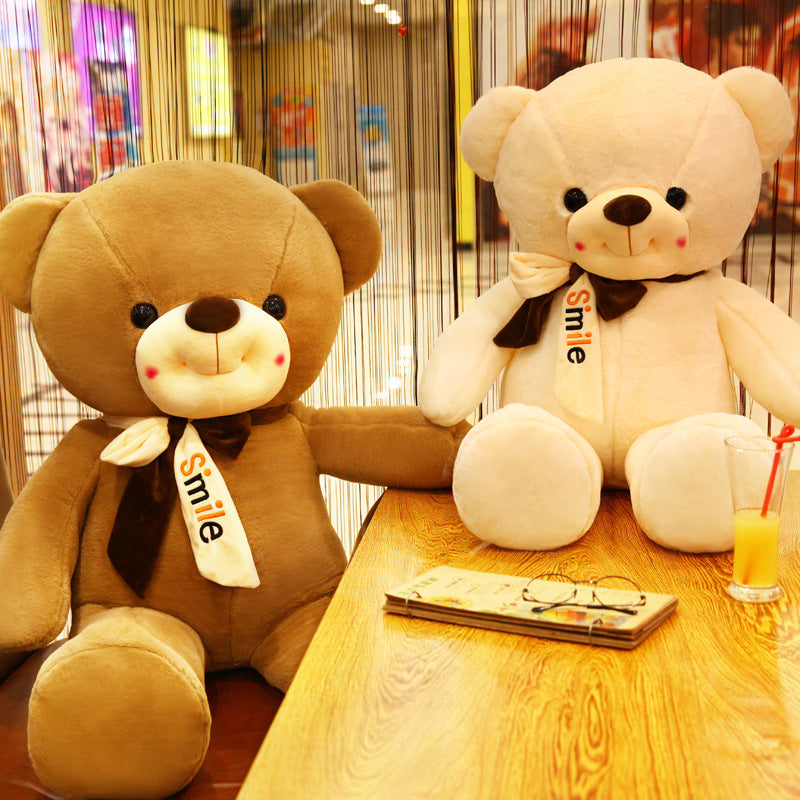 Smiling scarf teddy bear doll