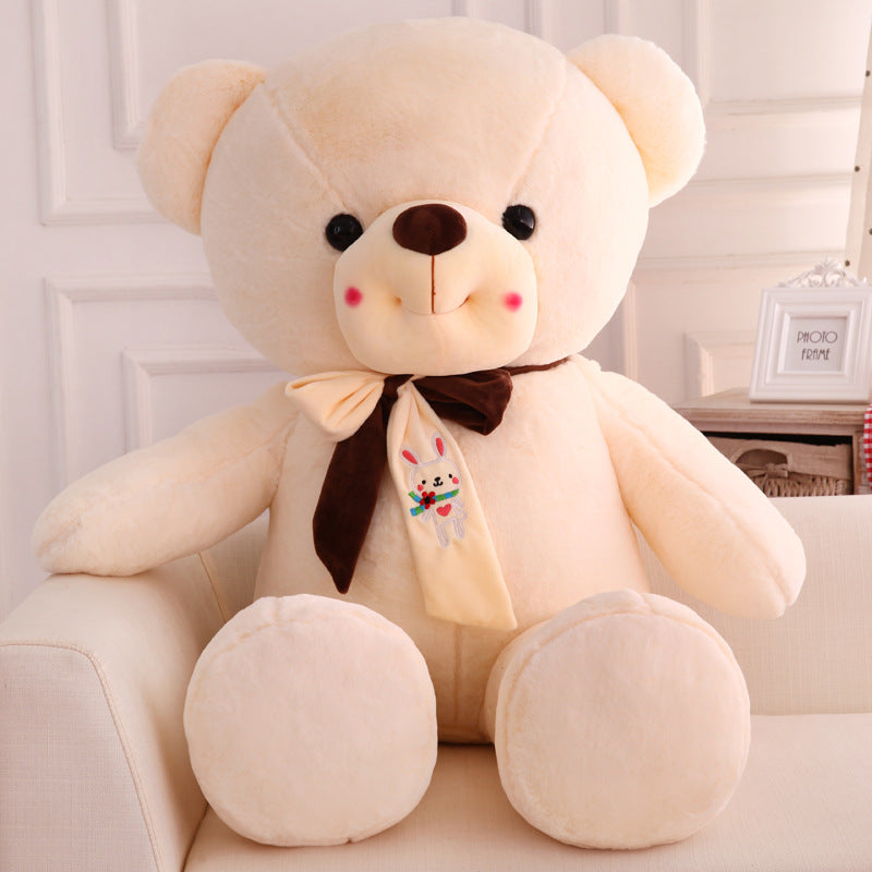 Smiling scarf teddy bear doll