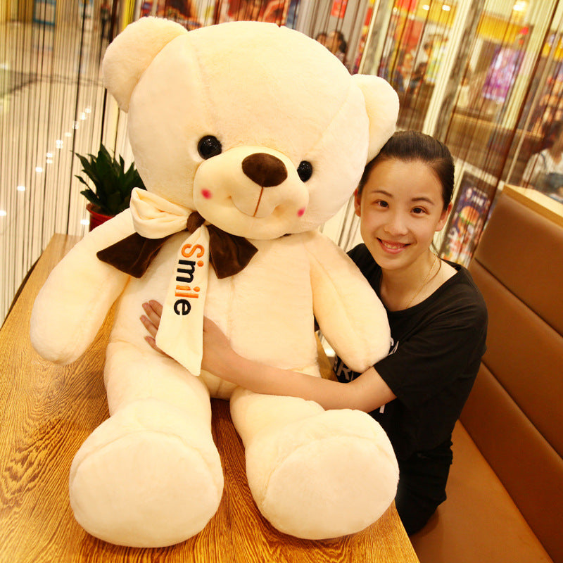 Smiling scarf teddy bear doll