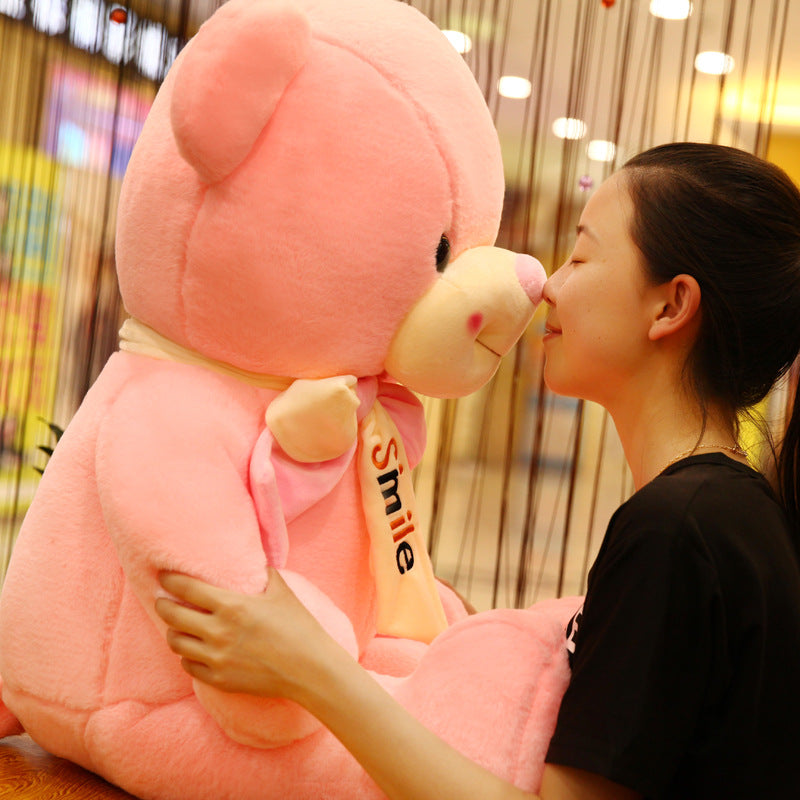 Smiling scarf teddy bear doll